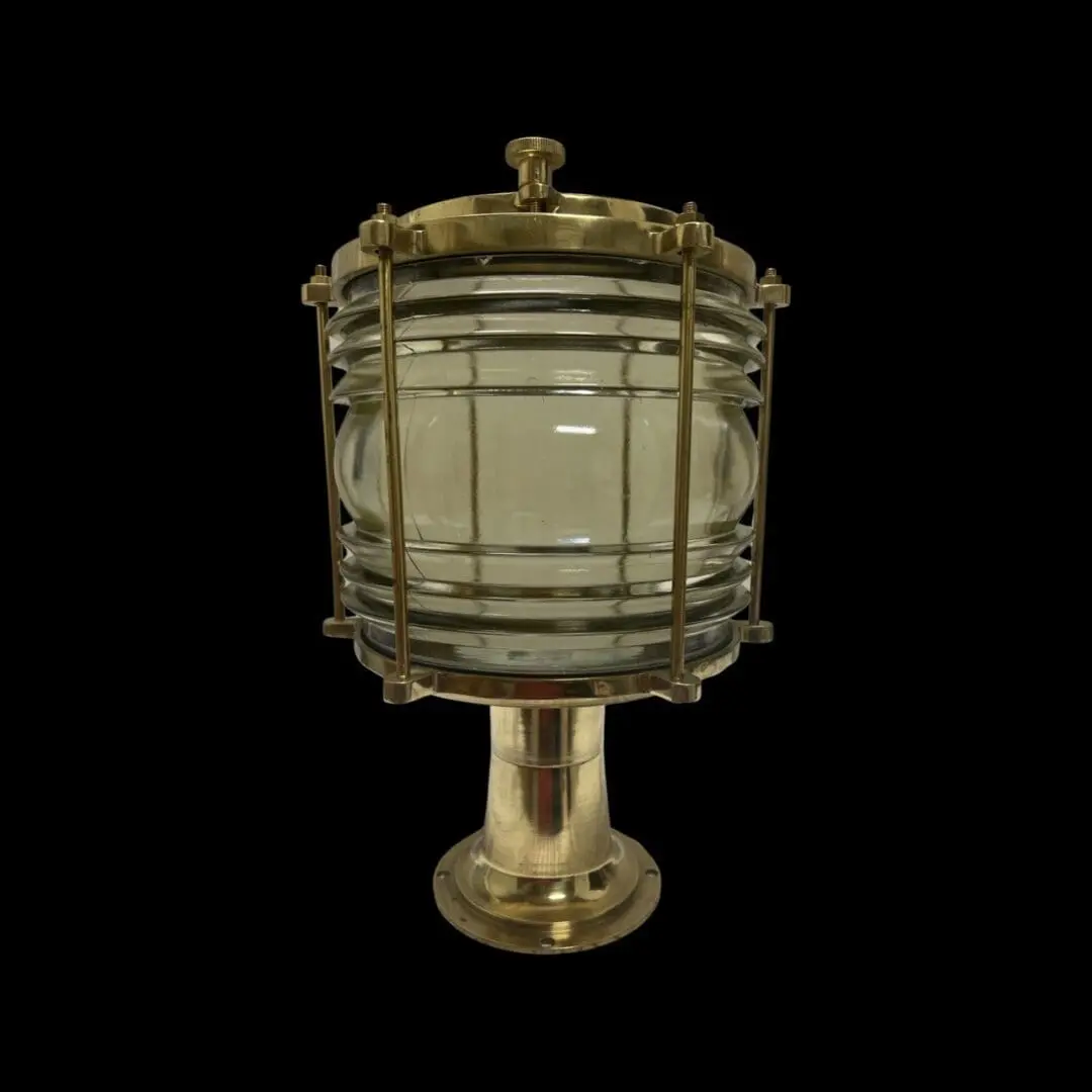 A brass lamp with a Bubble Top Post Light on top.