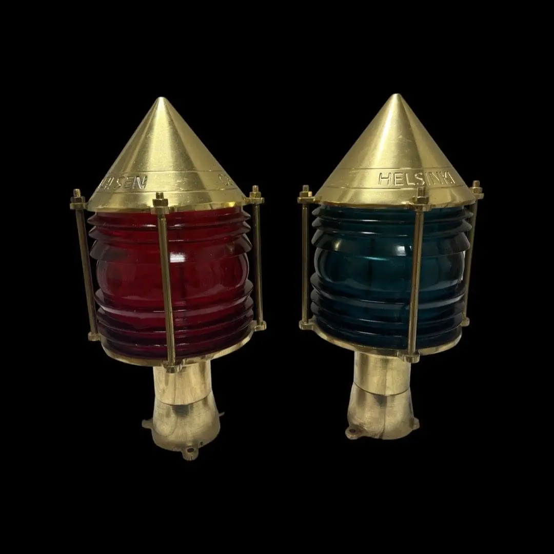 Two brass and red Bubble Top Post Lights on a black background.