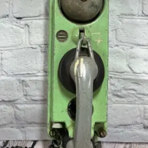 A green Clock with a metal handle on it – Hamilton Watch Co Clock.