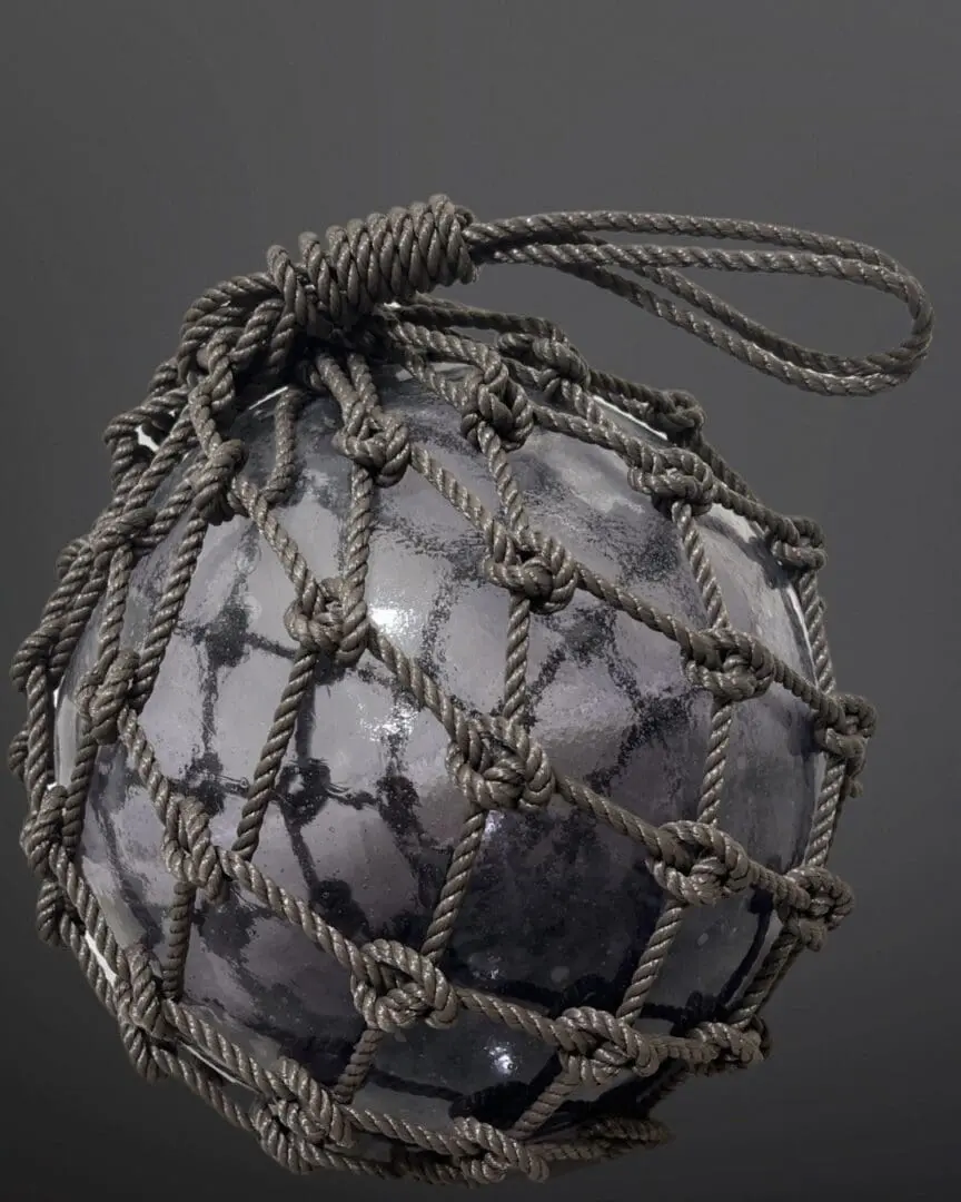 A ball with a string around it is shown.