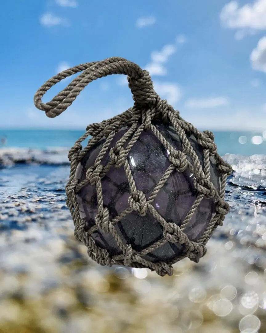 A ball of rope is hanging on the shore.
