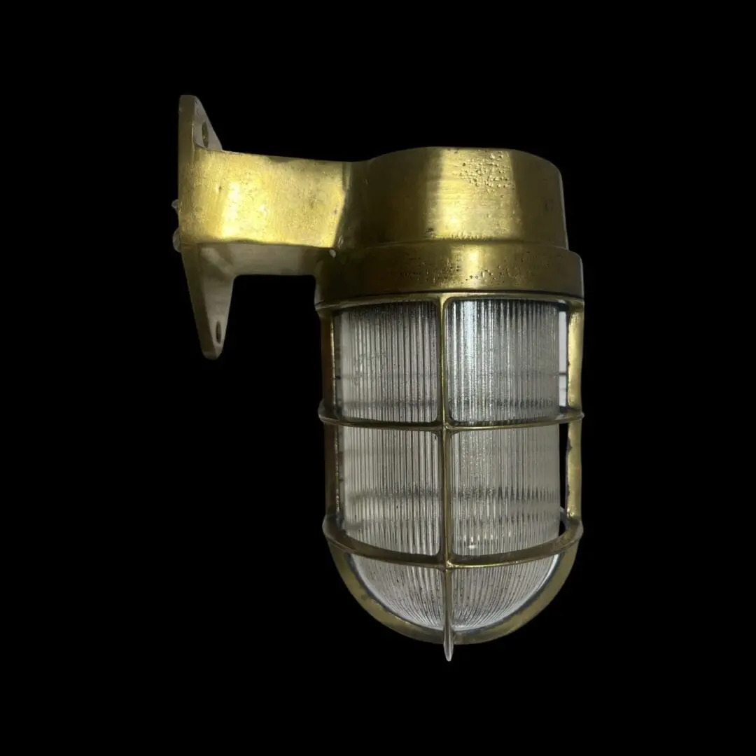 A close up of a light fixture on a wall