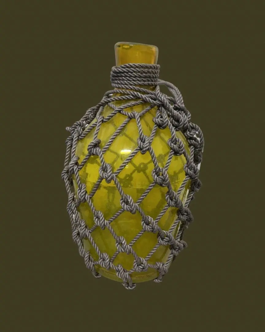 A yellow glass bottle with a string around it.