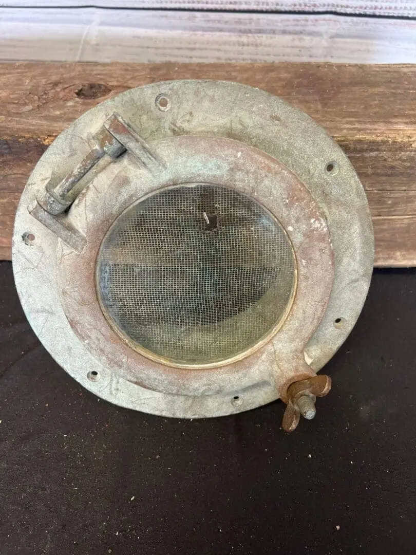 A metal round object sitting on top of a table.