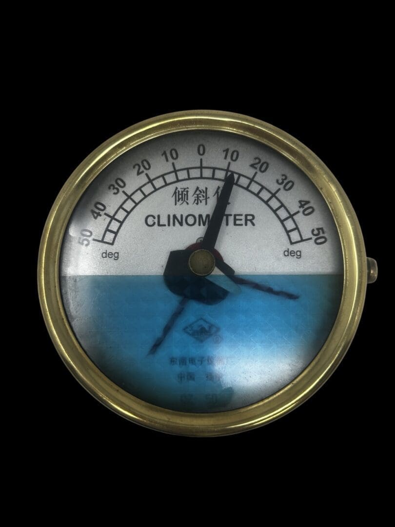 A close up of an analog thermometer