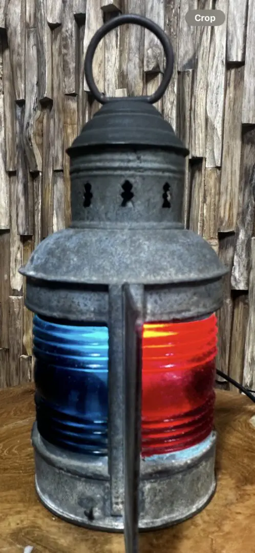 Vintage nautical lamp with blue and red glass.