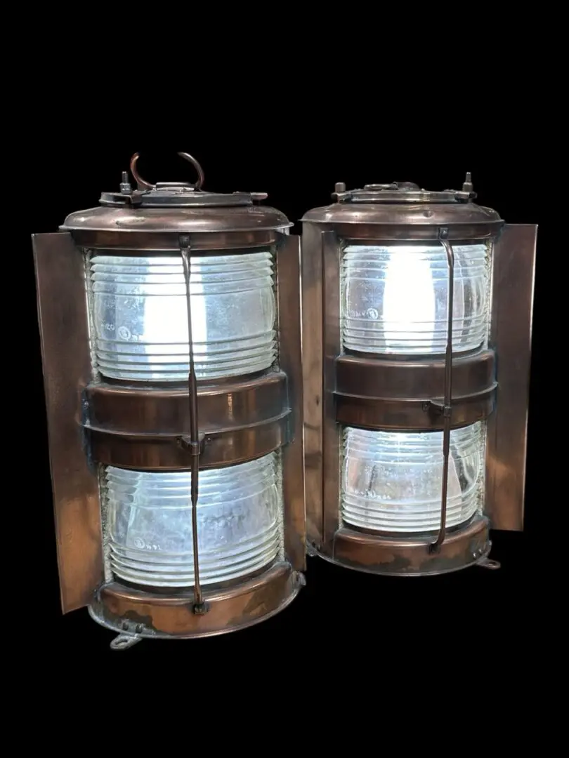 Two vintage copper nautical lanterns.