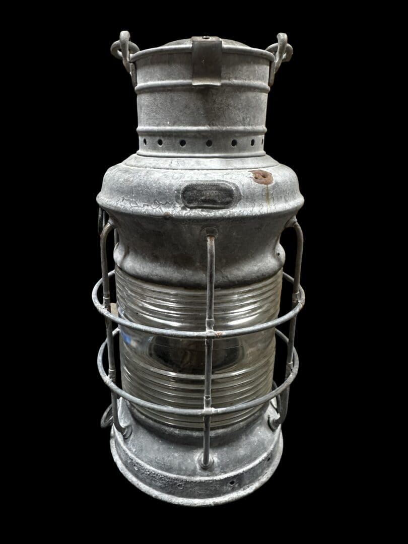Antique metal nautical oil lamp.