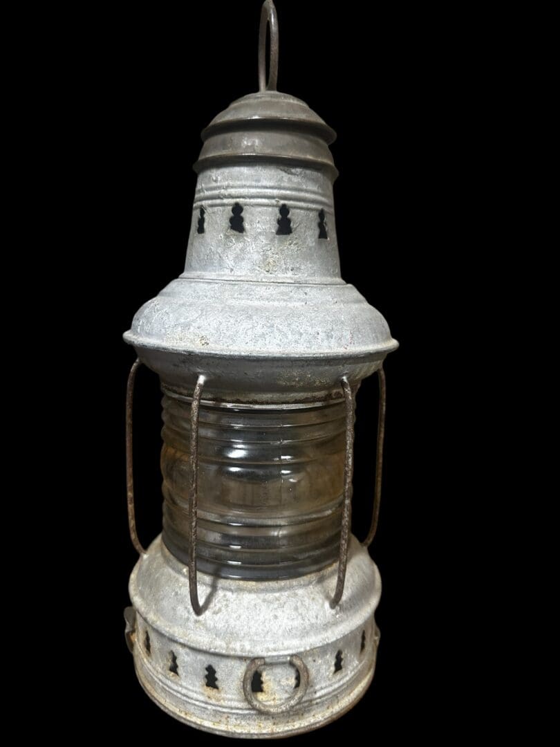 Vintage metal lantern with glass panels.