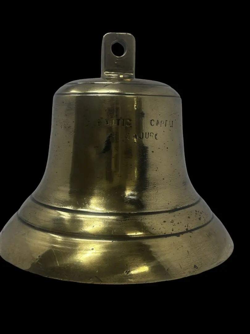 Brass ship bell with inscription.