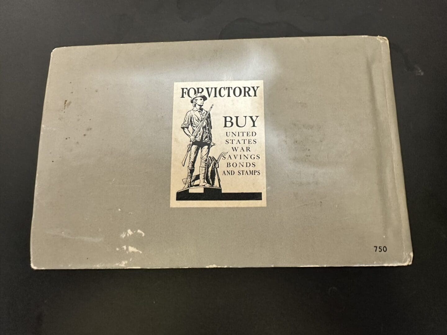 Old booklet urging to buy U.S. war savings bonds for victory.