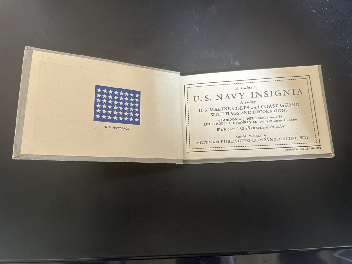 An open booklet titled 'A Guide to U.S. Navy Insignia' with a U.S. Navy Jack flag illustration.
