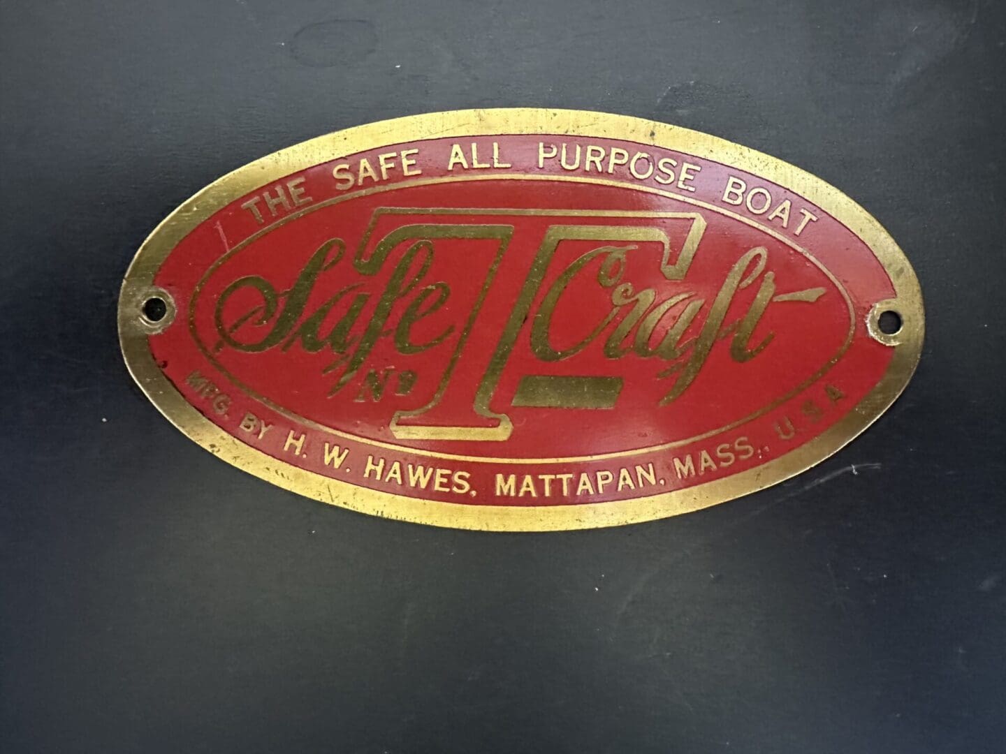 Vintage Safe-T-Craft boat manufacturer's emblem.