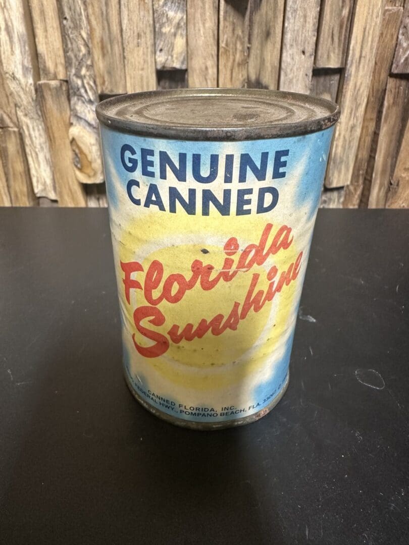 Vintage can labeled Genuine Canned Florida Sunshine with a bright design.