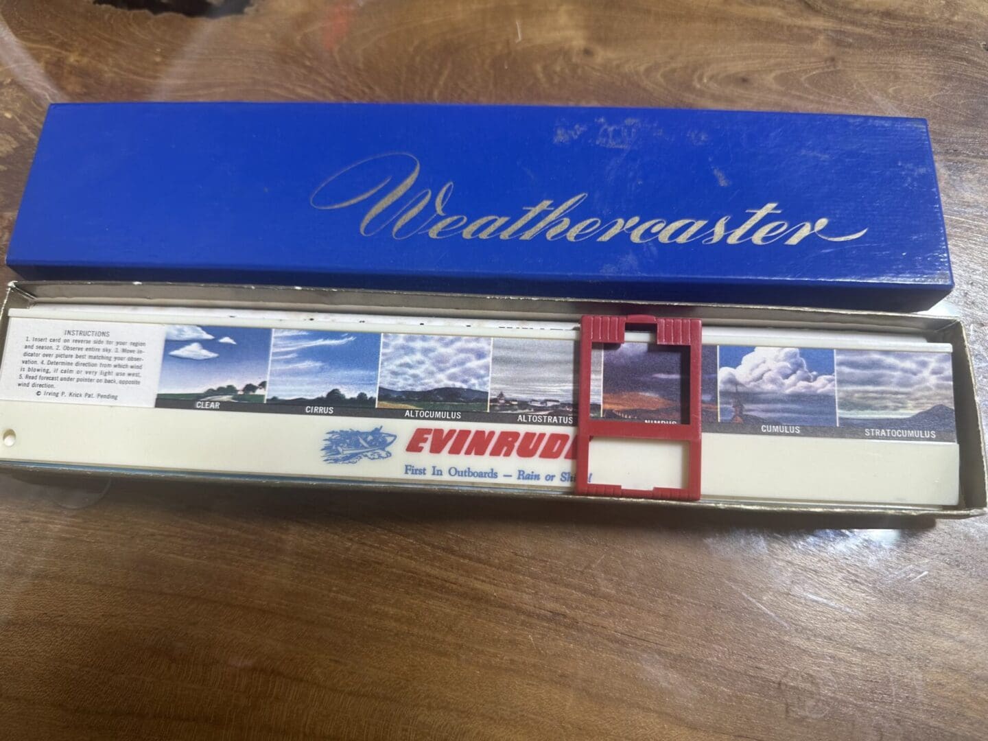 Vintage Weathercaster weather prediction tool in original blue box.
