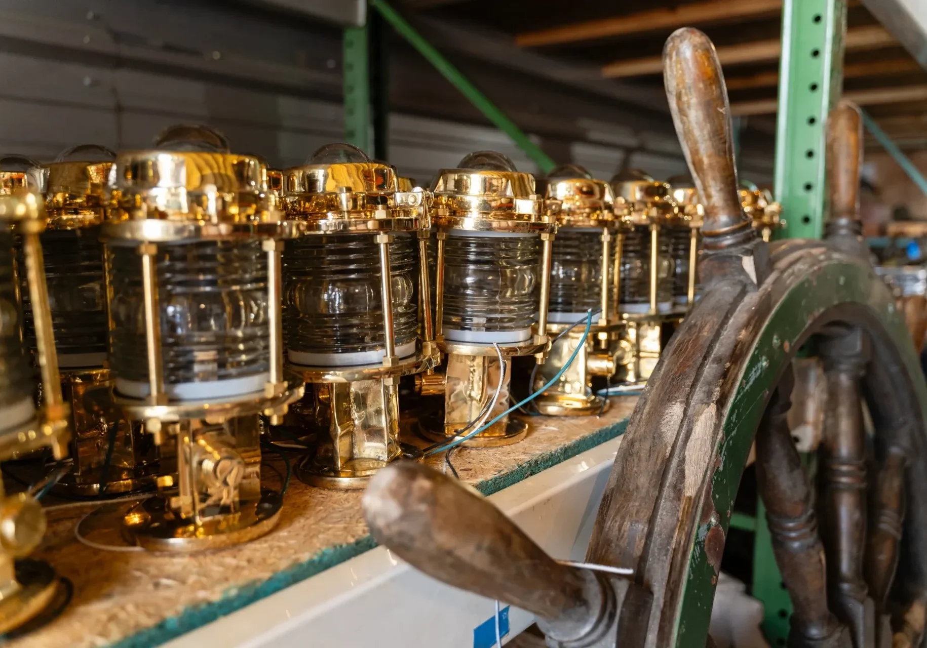 A row of brass lamps sitting on top of a table.